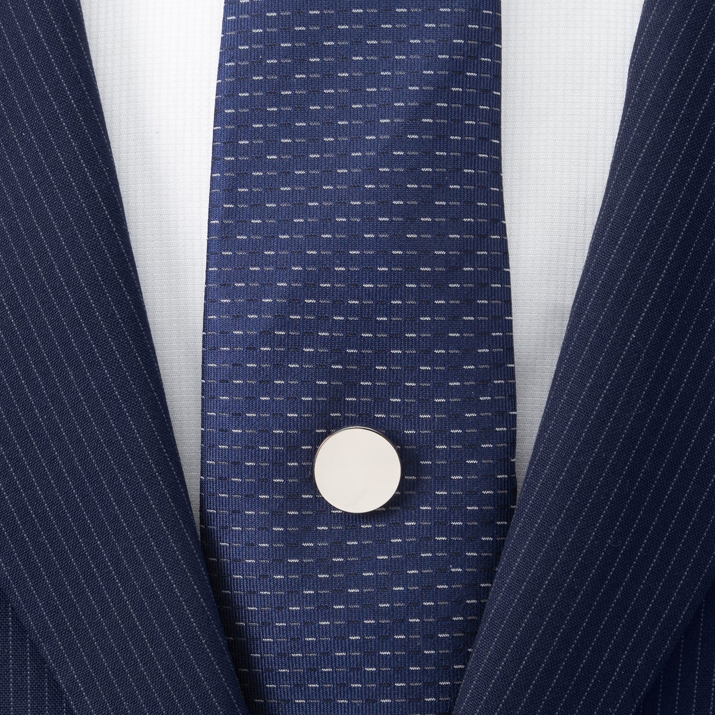 The Cufflinks.com Stainless Steel Engravable Round Infinity Tie Tac features a smooth, reflective silver finish and flat, circular design, shown here against a white background.