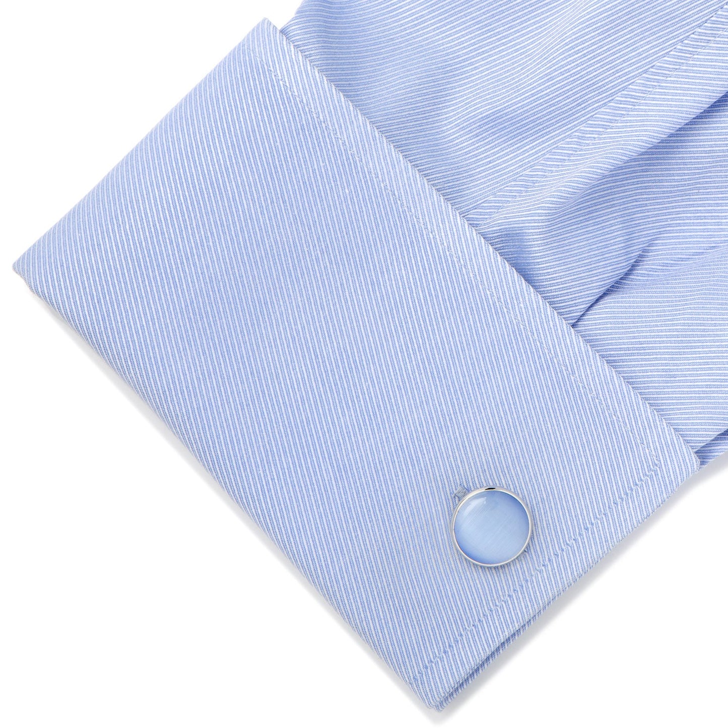 The Silver and Blue Catseye Cufflinks by Cufflinks.com feature round, light blue polished faces with silver-tone settings, elegantly displayed on a white background—an ideal men's accessory.