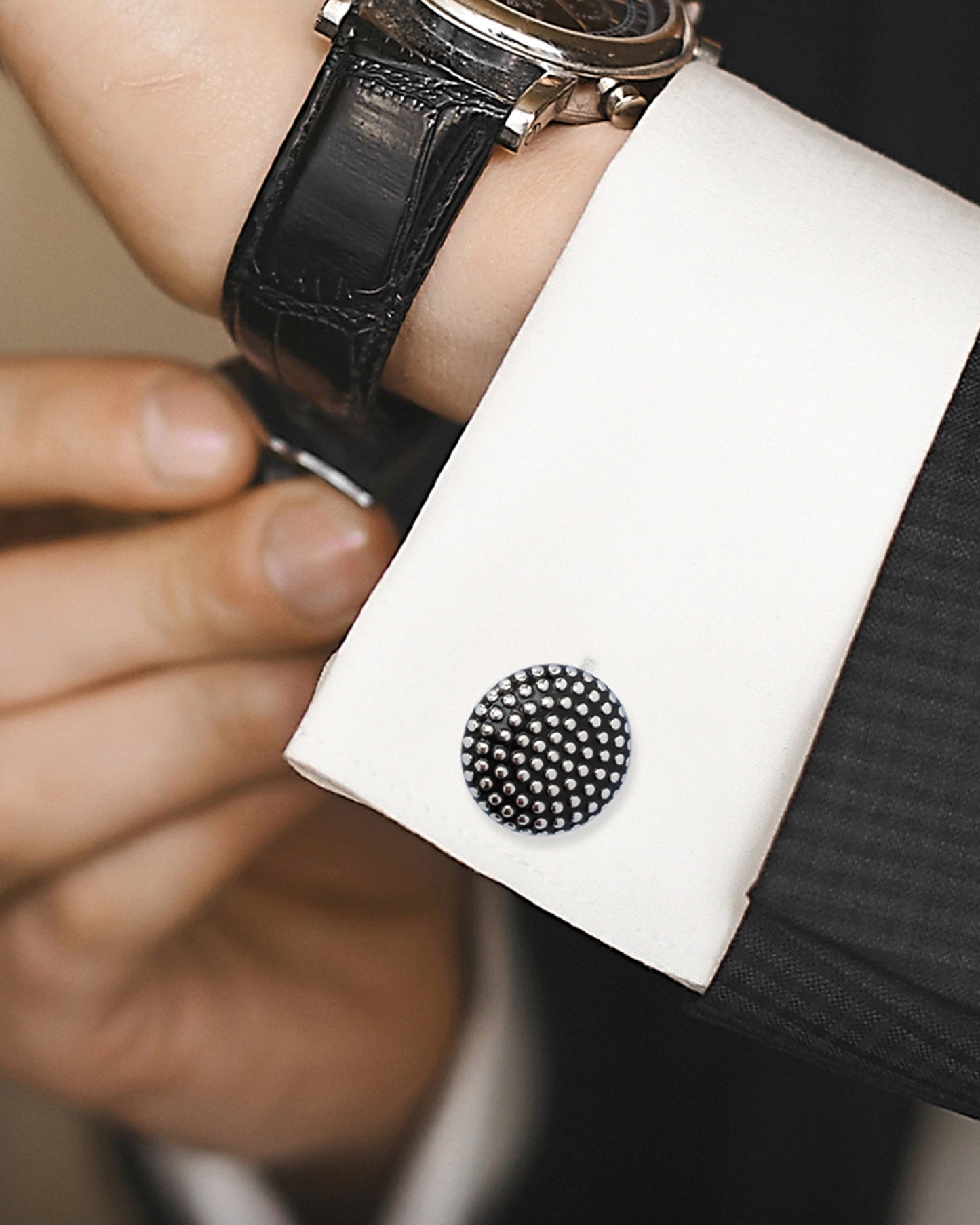 The Silver Circle Dot Texture Cufflinks by Cufflinks.com feature a stylish, textured surface with polished raised dots on a dark background—perfect for those who appreciate modern sophistication in their accessories.