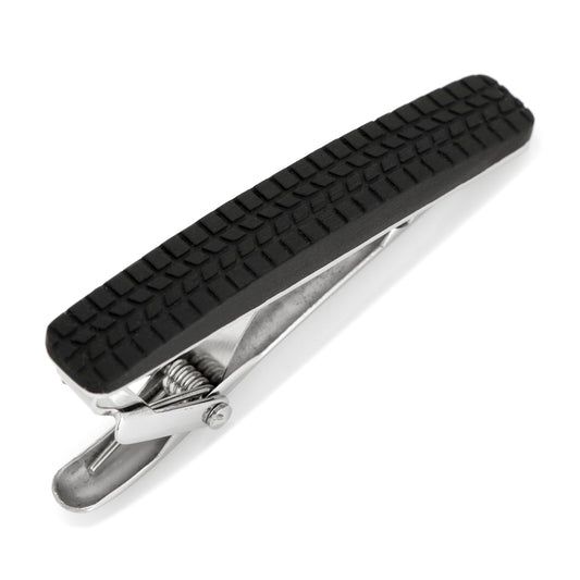 The Cufflinks.com Stainless Steel Carbon Fiber Tire Tread Tie Clip features a black, tire tread-inspired carbon fiber grip on top, displayed against a white background.