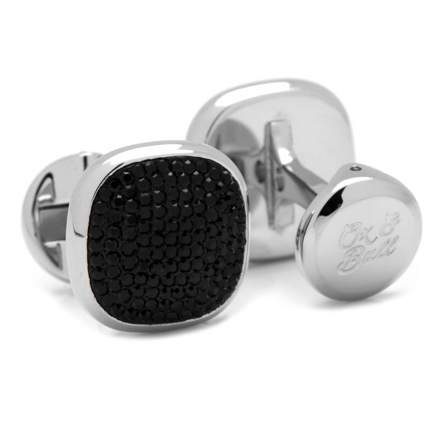 The Cufflinks.com Stainless Steel Black Pave Crystal 5-Stud Set features sleek cufflinks and shirt studs with black textured faces, elegantly displayed on a white background.