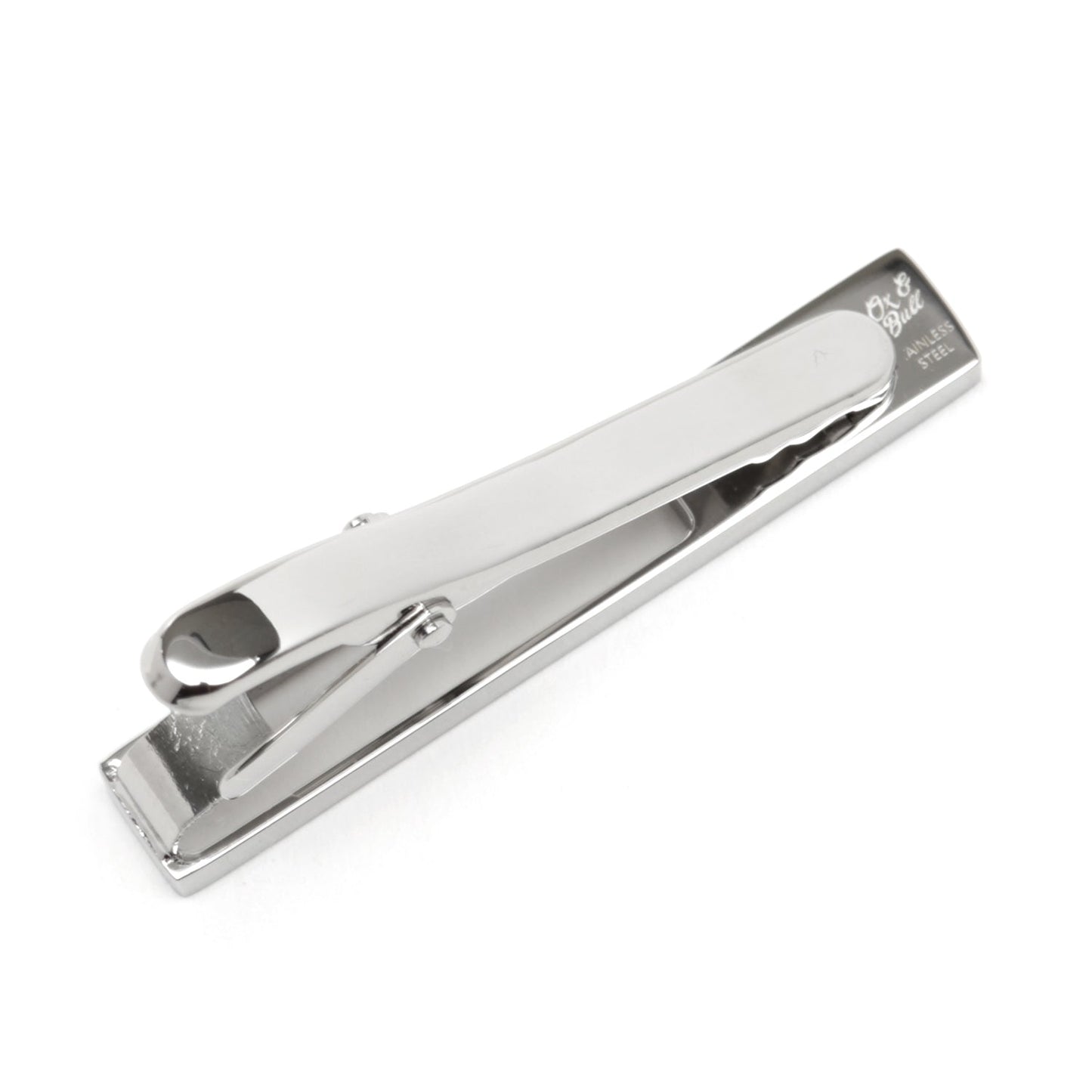The Die Cut Crystal Stainless Steel Tie Clip by Cufflinks.com features a rectangular cutout design with a row of clear gemstones on one end, crafted from stainless steel and shown on a white background.