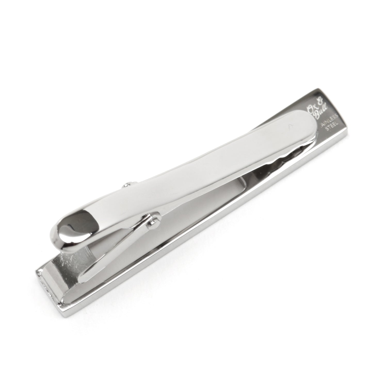 The Die Cut Crystal Stainless Steel Tie Clip by Cufflinks.com features a rectangular cutout design with a row of clear gemstones on one end, crafted from stainless steel and shown on a white background.