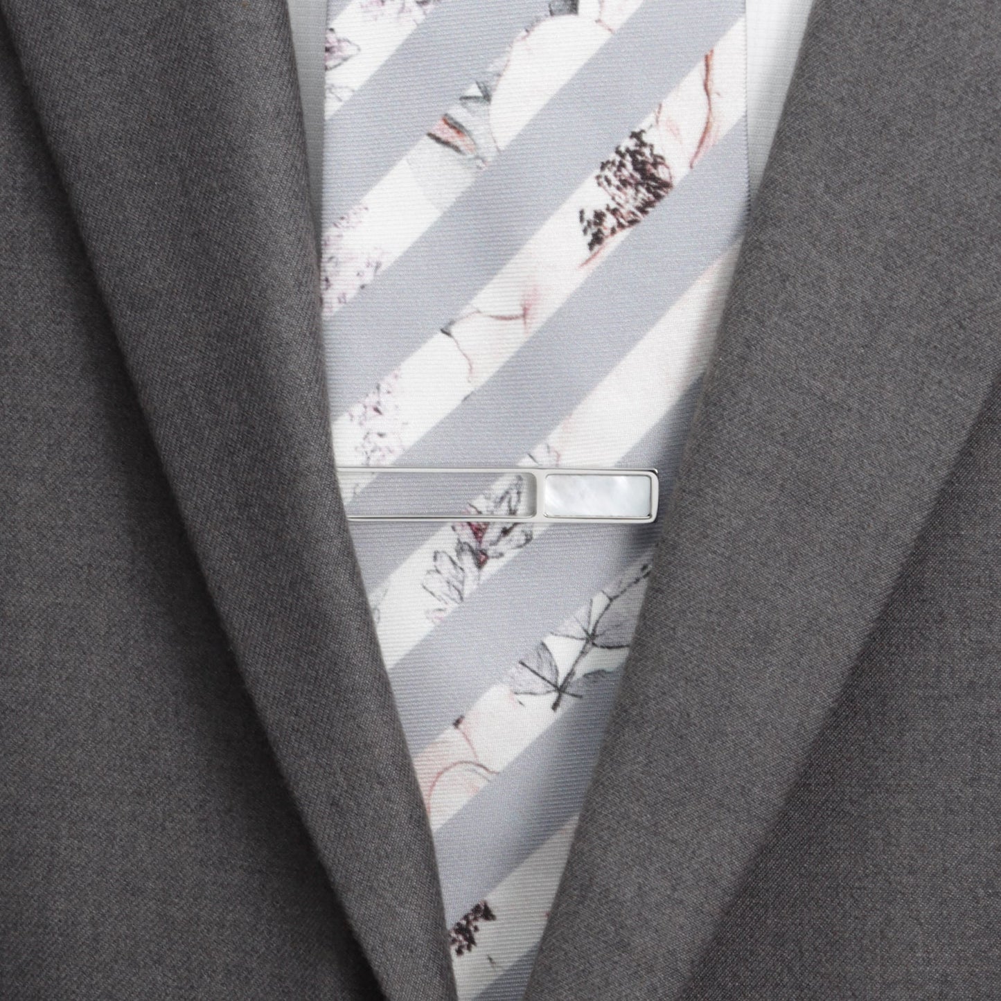 The Cufflinks.com Die Cut Mother of Pearl Stainless Steel Tie Clip features a rectangular mother of pearl inlay and is displayed on a white background.