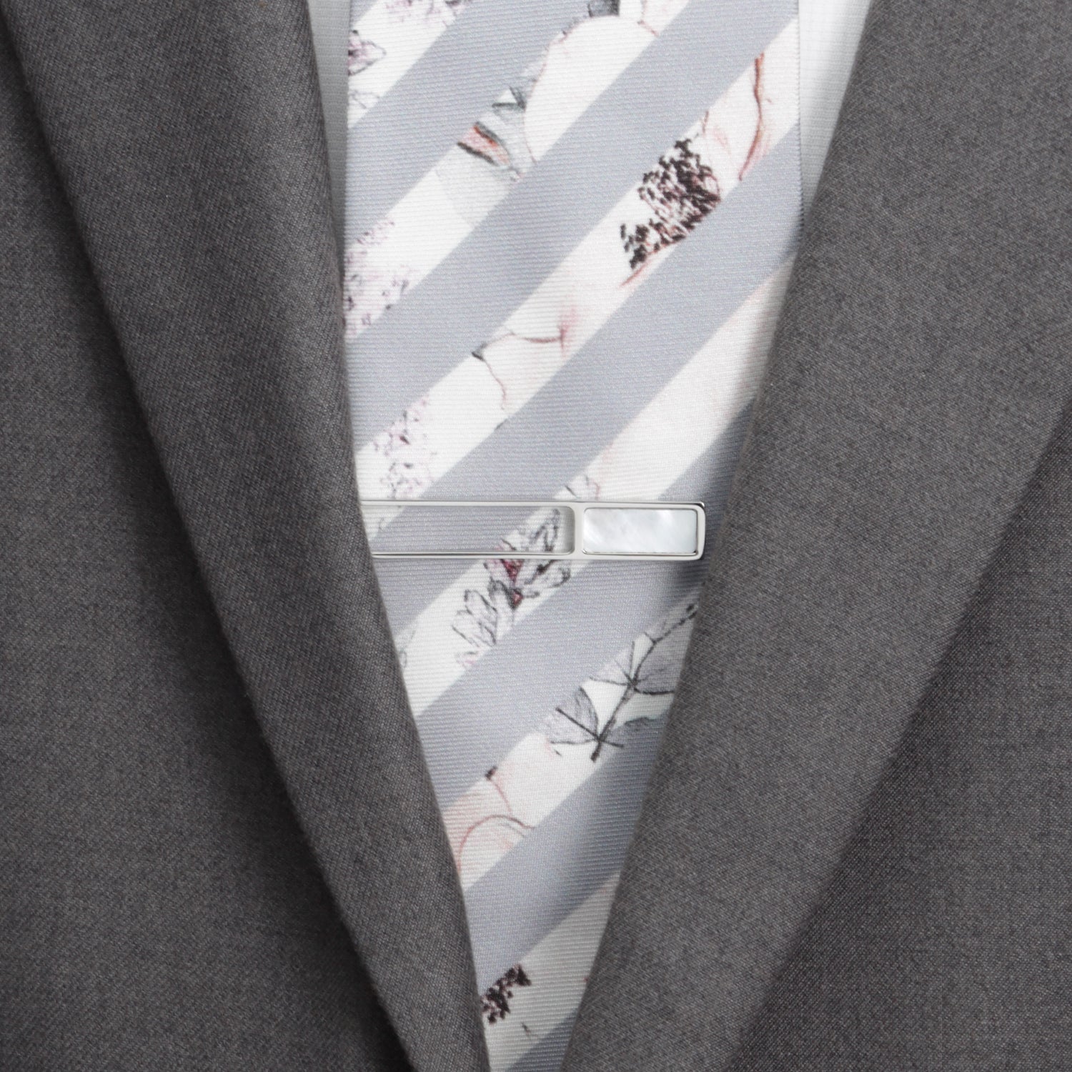 The Cufflinks.com Die Cut Mother of Pearl Stainless Steel Tie Clip features a rectangular mother of pearl inlay and is displayed on a white background.