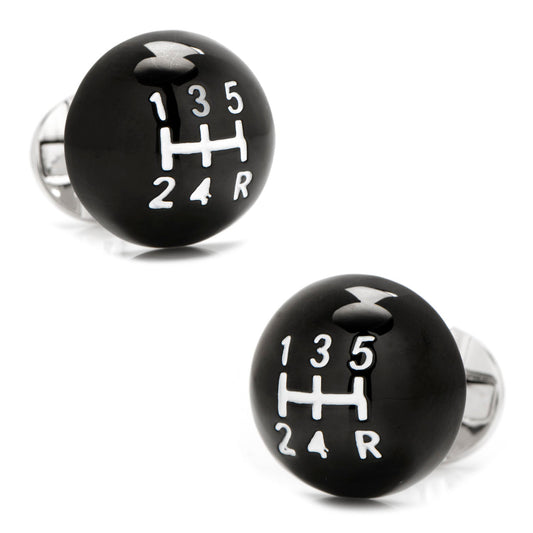 The 3D Black Gear Shifter Cufflinks by Cufflinks.com feature a round black design with a white five-speed manual shift pattern and an 'R' for reverse.