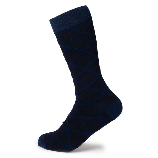 The Grid Navy Men's Sock by Cufflinks.com is crafted from a soft cotton blend, featuring a subtle light blue diamond grid pattern, and is shown against a white background.