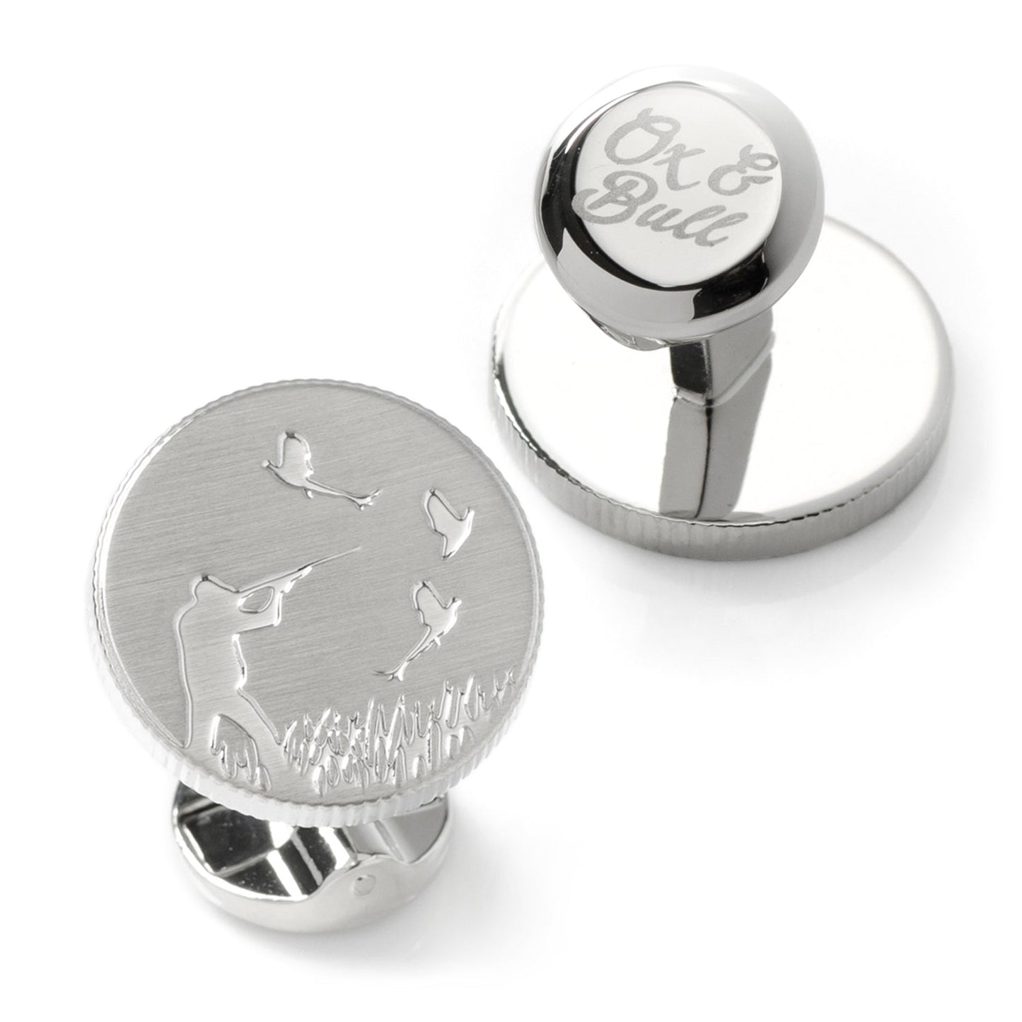 Hunter Silver Cufflinks by Cufflinks.com feature an engraved hunter aiming at flying birds above grass. With a brushed finish, they add rugged charm to any outfit.