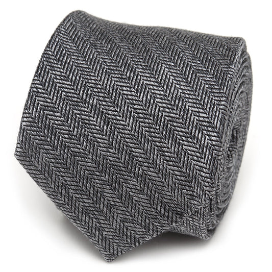 The Herringbone Men's Tie by Cufflinks.com features a rolled-up gray silk design with a classic herringbone stitch pattern on a white background.