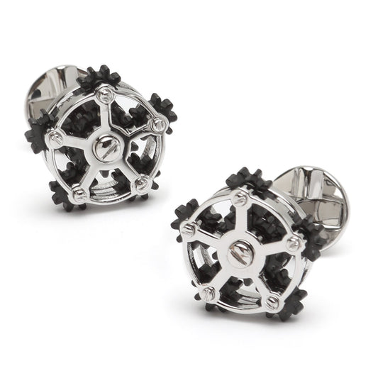 The Rotating Gear Cufflinks by Cufflinks.com feature a sterling silver and black design resembling interlocking gears, shown on a white background.