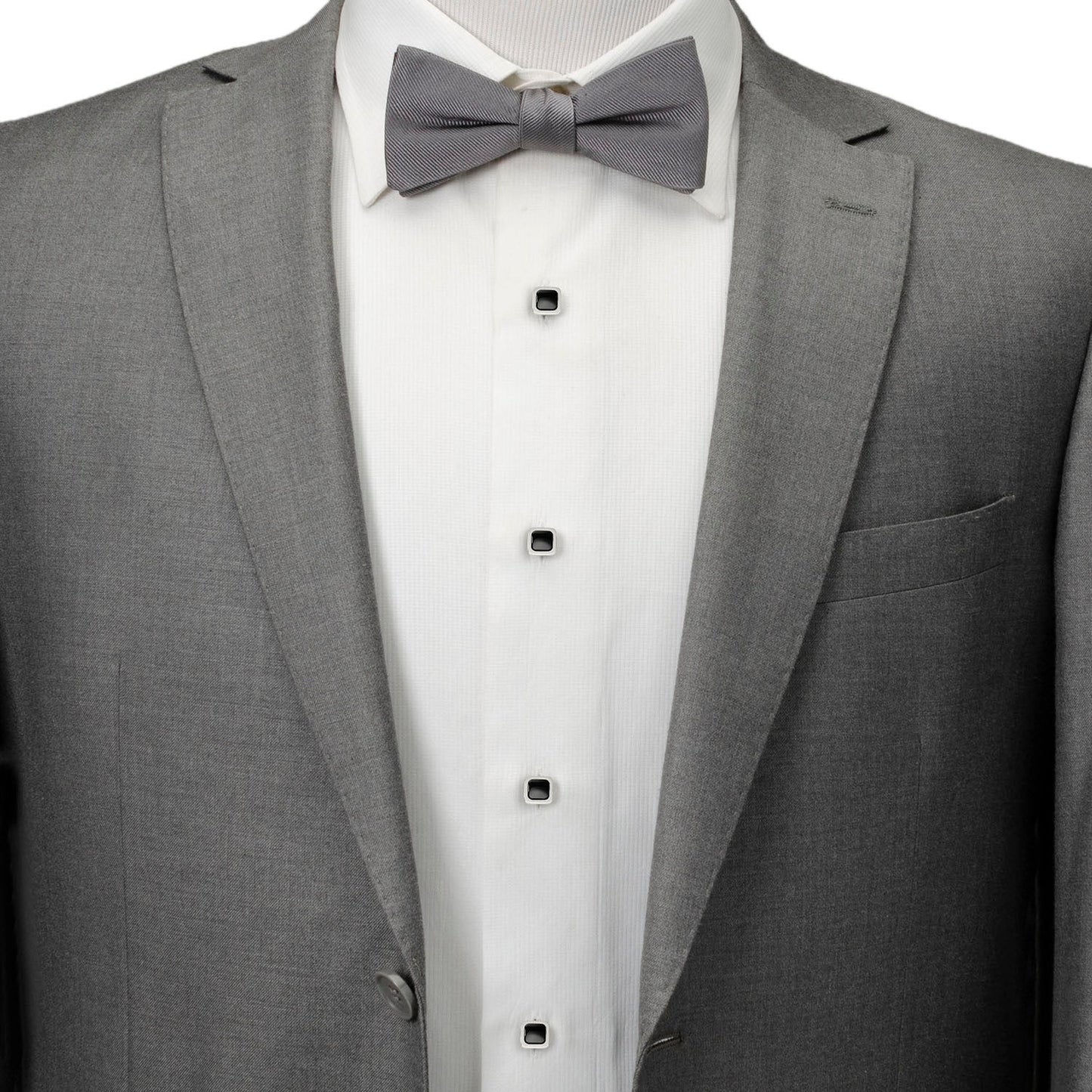 The Onyx Cushion Stainless Steel 5-Stud Set by Cufflinks.com features silver cufflinks and stainless steel studs with black square centers, shown on a white background.