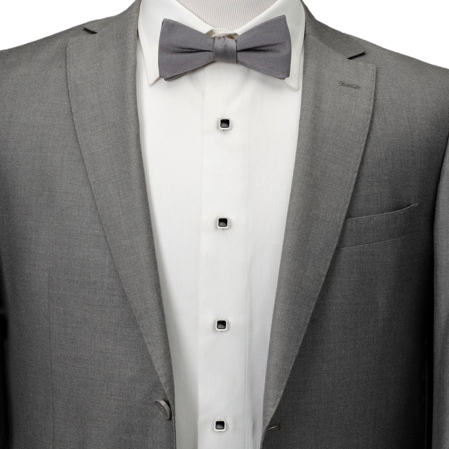 The Onyx Cushion Stainless Steel 5-Stud Set by Cufflinks.com features silver cufflinks and stainless steel studs with black square centers, shown on a white background.