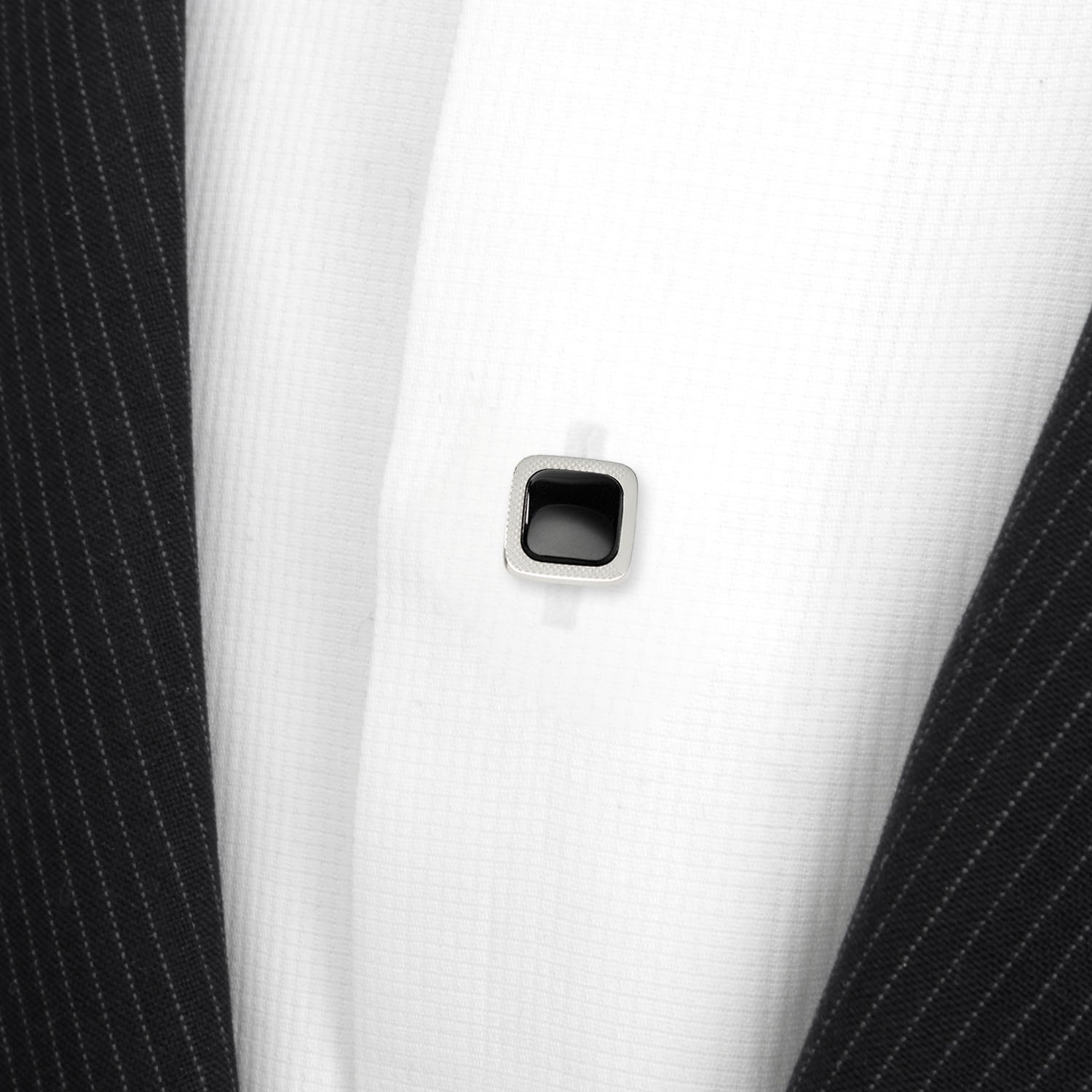 The Onyx Cushion Stainless Steel 5-Stud Set by Cufflinks.com features silver cufflinks and stainless steel studs with black square centers, shown on a white background.