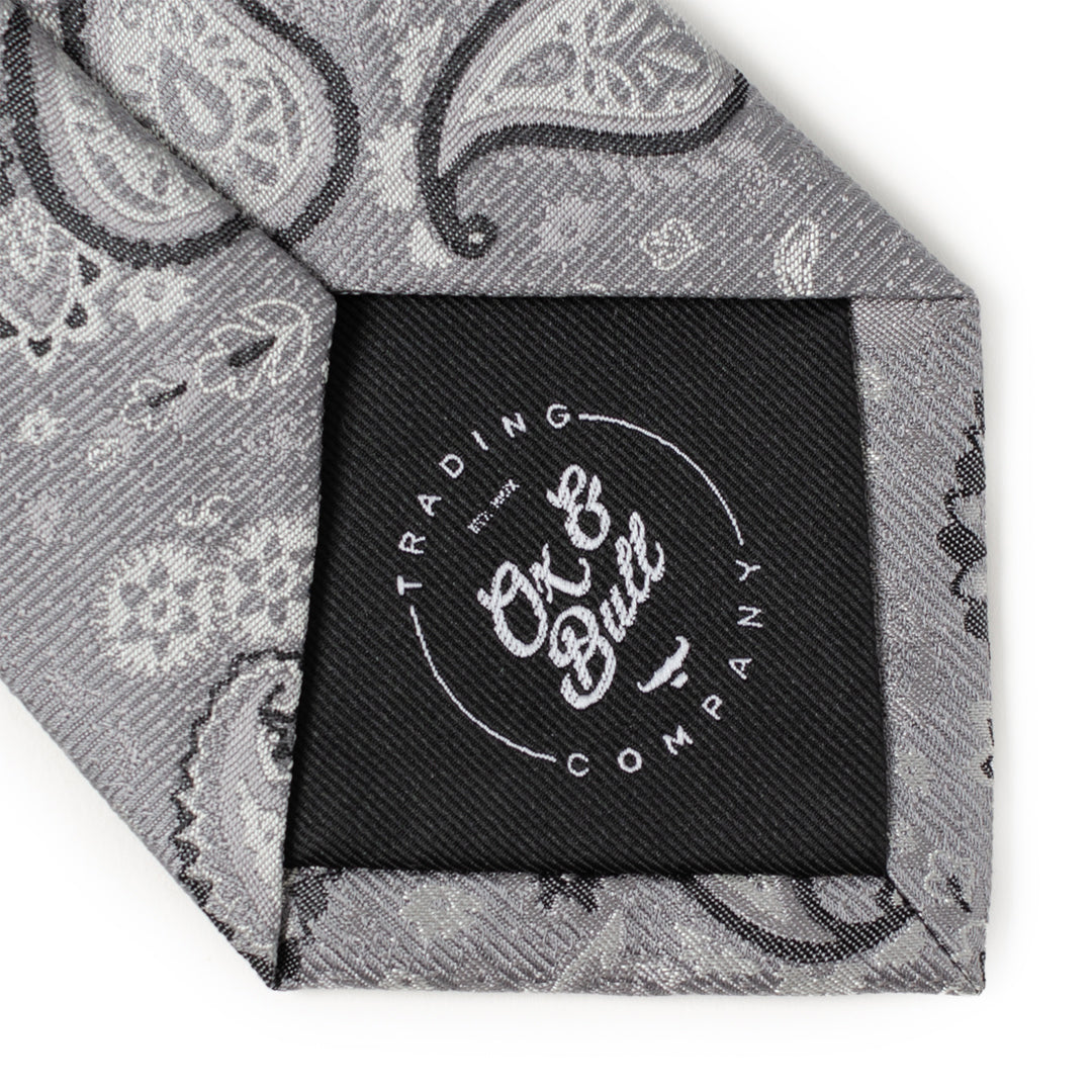 The Gray Paisley Men's Tie by Cufflinks.com features an elegant paisley pattern in shades of gray and silver.