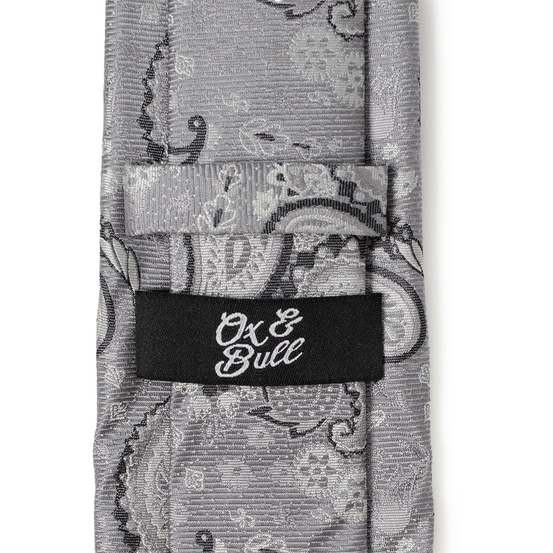 The Gray Paisley Men's Tie by Cufflinks.com features an elegant paisley pattern in shades of gray and silver.