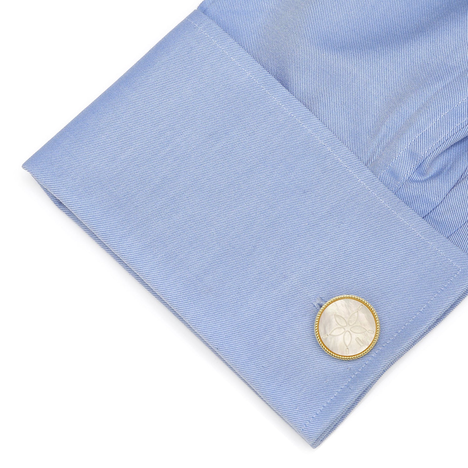 The Sand Dollar Cufflinks by Cufflinks.com feature round mother-of-pearl faces, each intricately engraved with a sand dollar design.