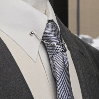 The Cufflinks.com Stainless Steel Chain Collar Bar features a silver finish with end balls and a chain, creating an elegant curve for a polished, formal touch to any outfit. Made from durable stainless steel.