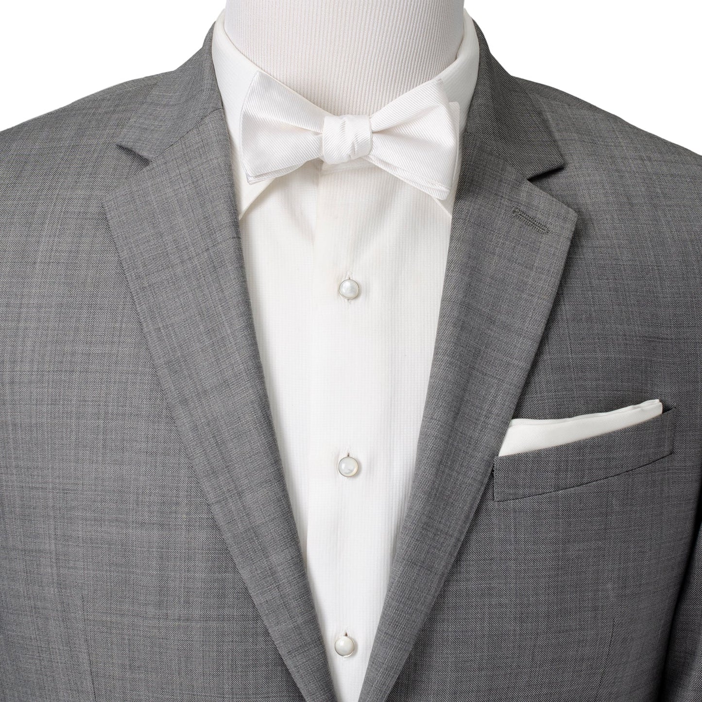 The White Silk Self Bow Tie by Cufflinks.com features ribbed silk fabric, an adjustable strap, and is shown tied and untied.