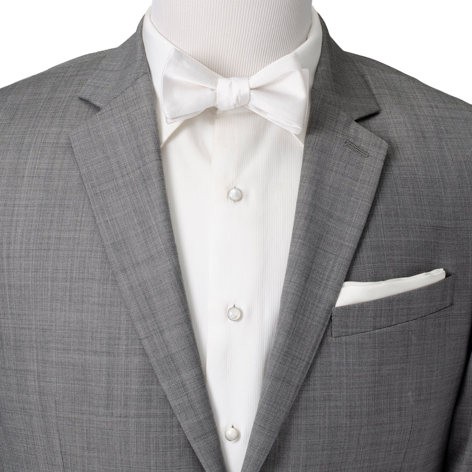 The White Silk Self Bow Tie by Cufflinks.com features ribbed silk fabric, an adjustable strap, and is shown tied and untied.
