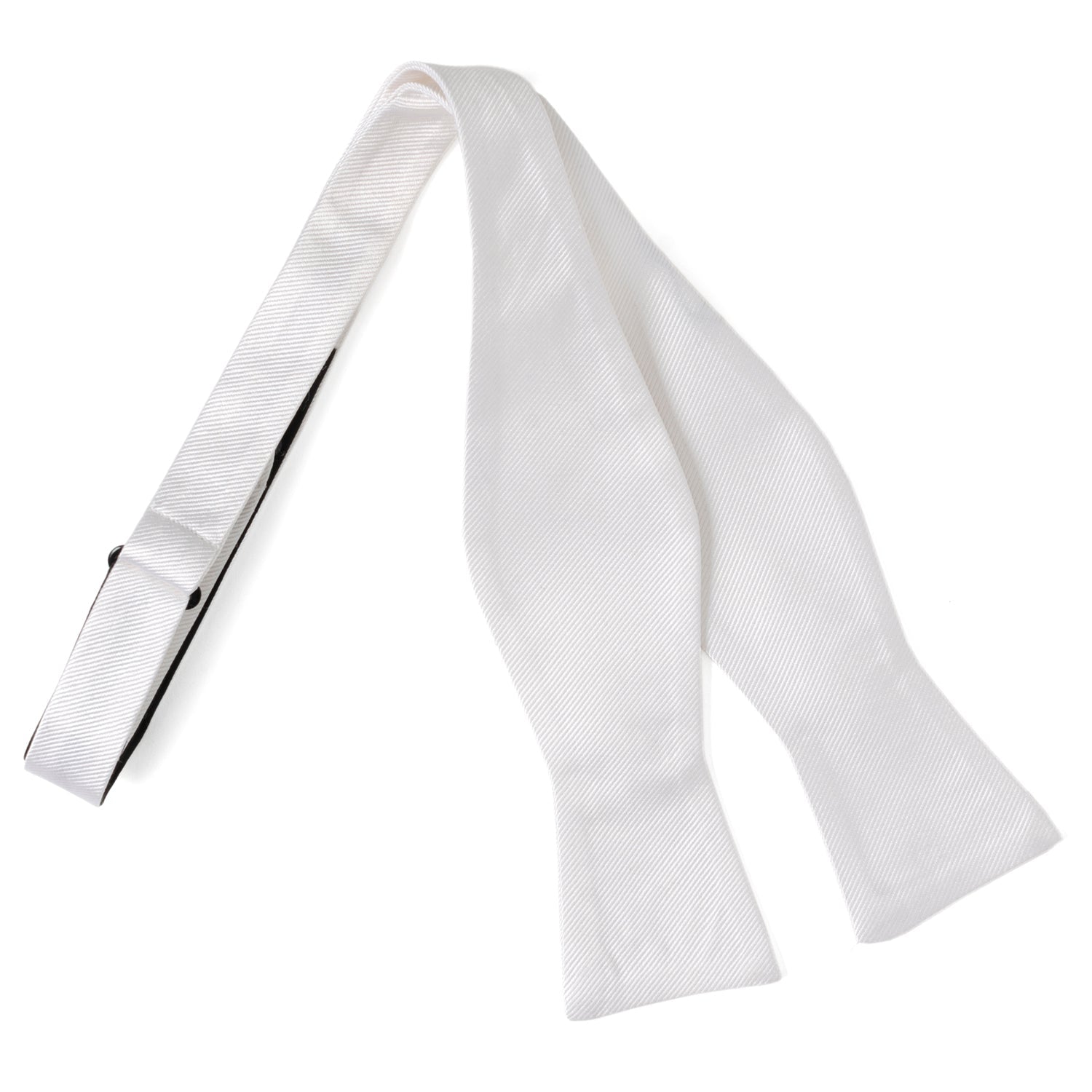 The White Silk Self Bow Tie by Cufflinks.com features ribbed silk fabric, an adjustable strap, and is shown tied and untied.