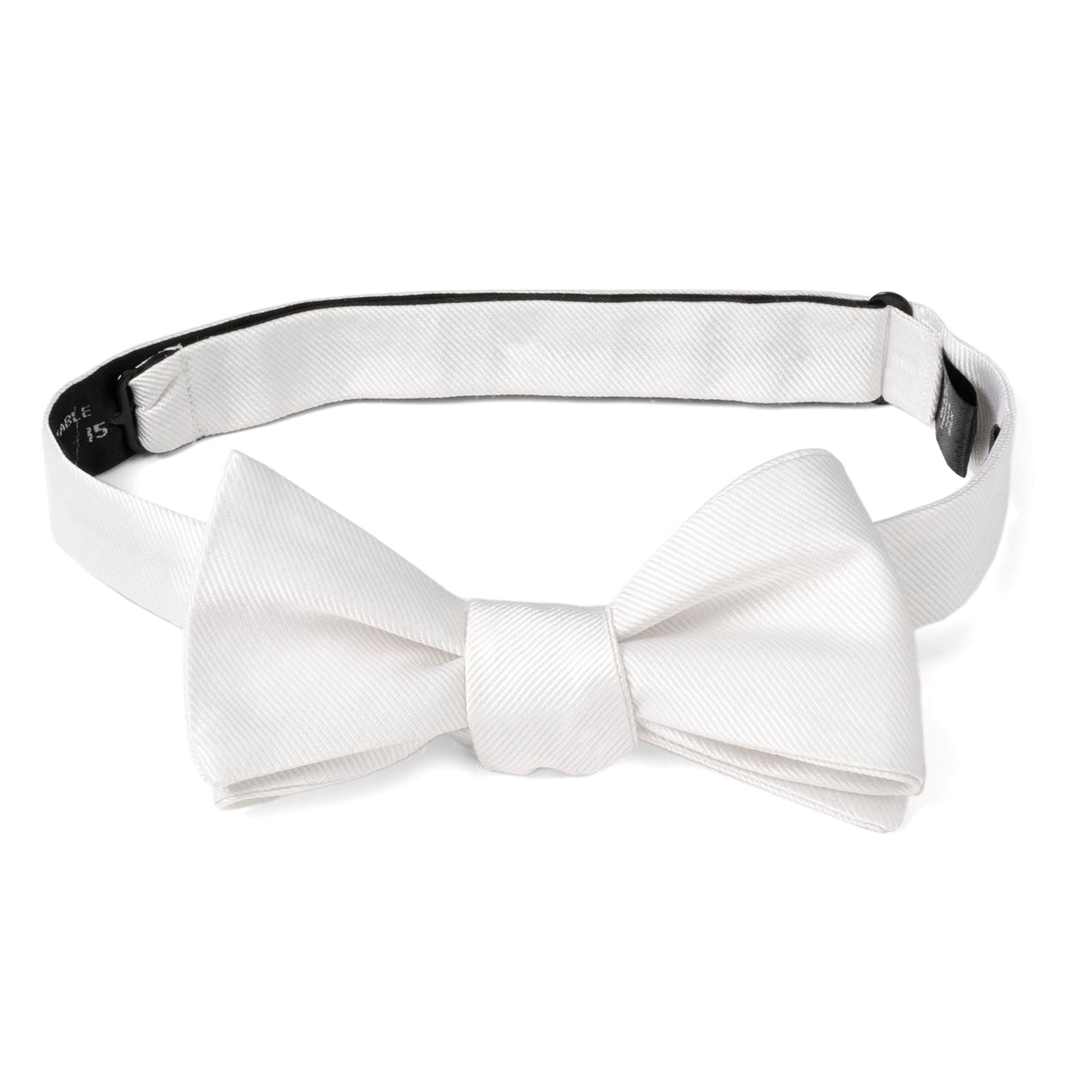 The White Silk Self Bow Tie by Cufflinks.com features ribbed silk fabric, an adjustable strap, and is shown tied and untied.