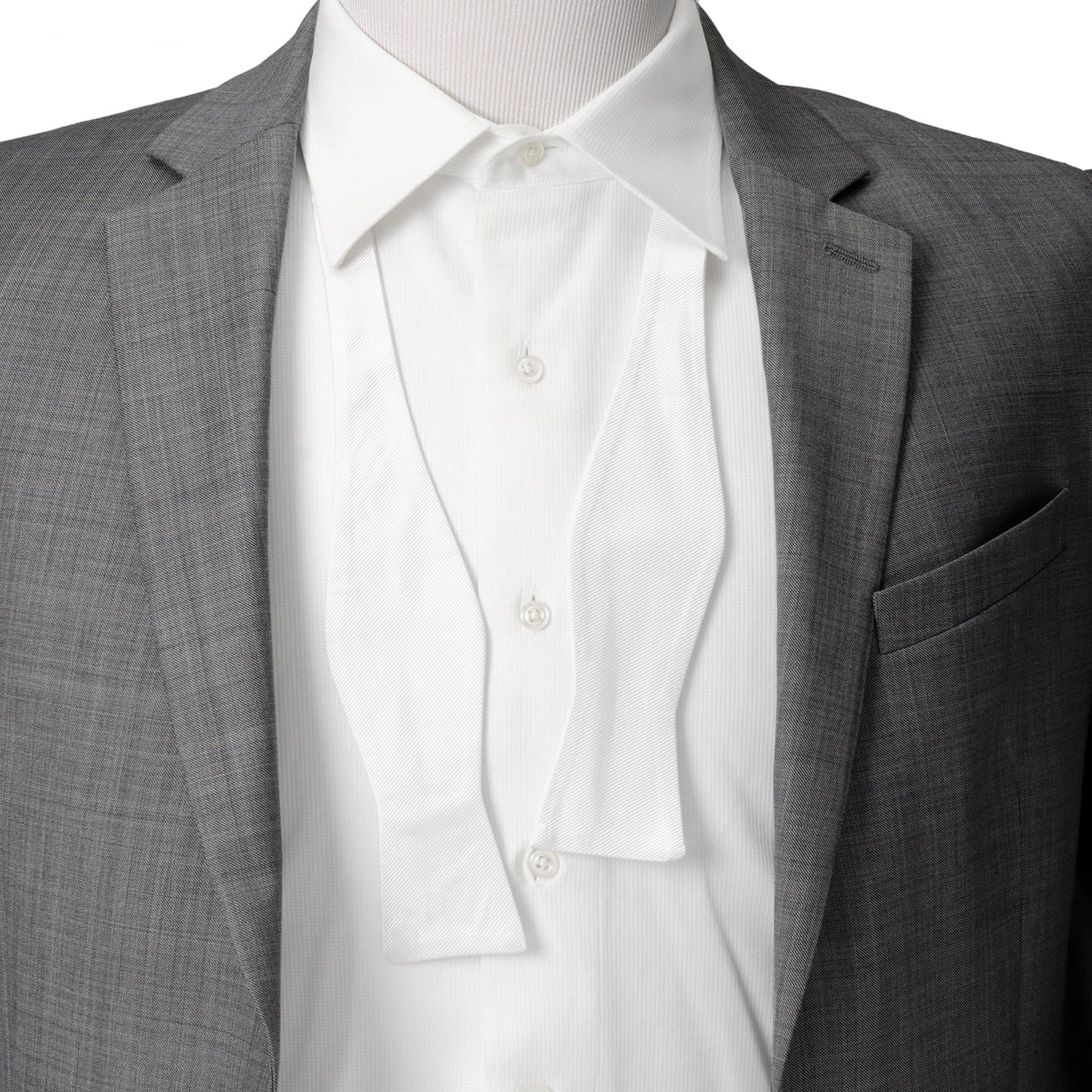 The White Silk Self Bow Tie by Cufflinks.com features ribbed silk fabric, an adjustable strap, and is shown tied and untied.