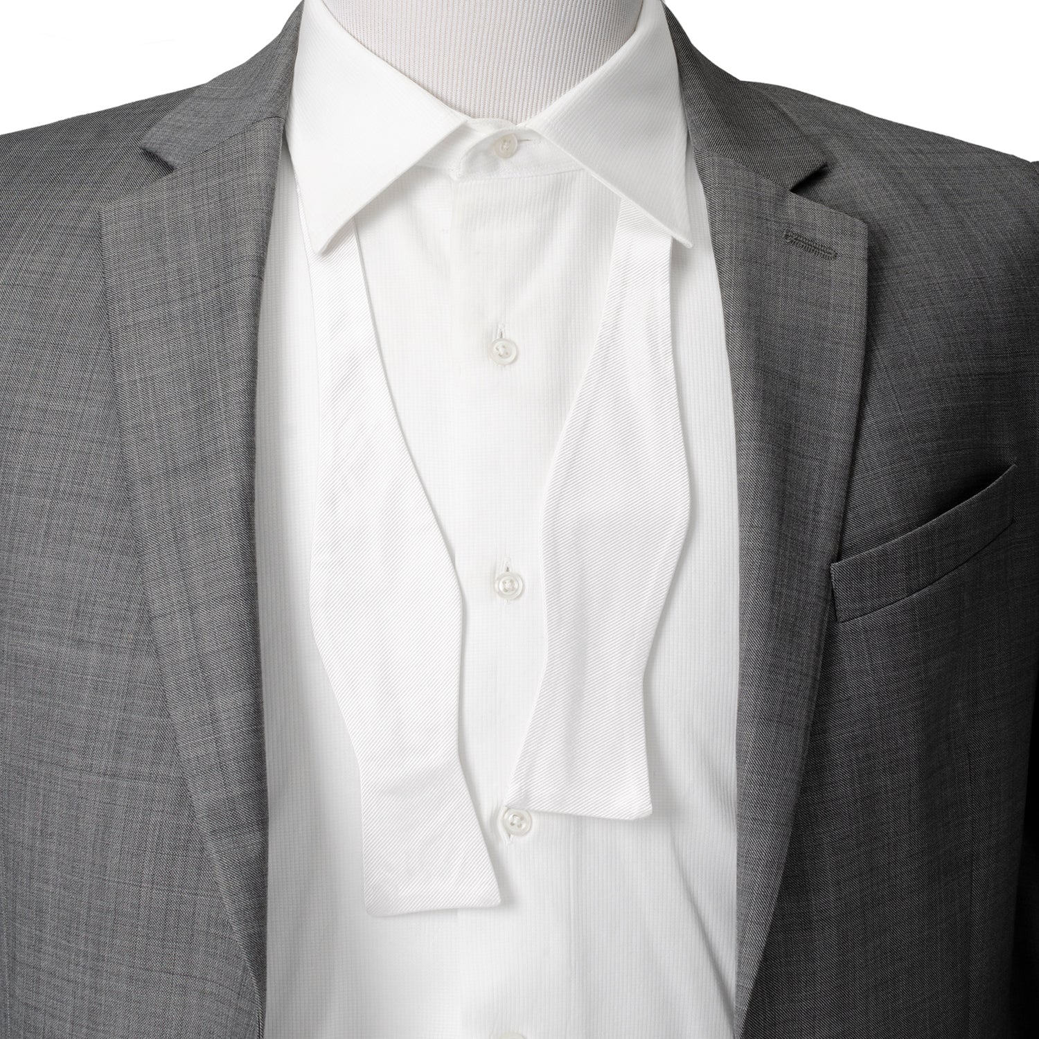 The White Silk Self Bow Tie by Cufflinks.com features ribbed silk fabric, an adjustable strap, and is shown tied and untied.