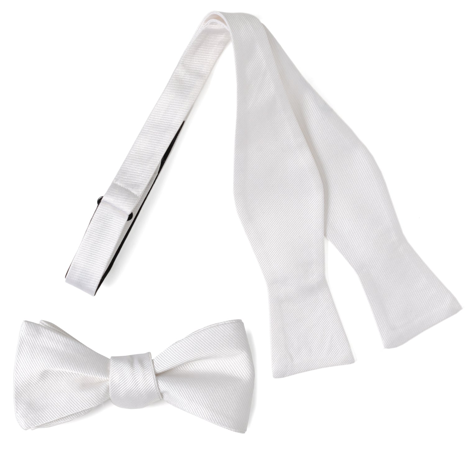 The White Silk Self Bow Tie by Cufflinks.com features ribbed silk fabric, an adjustable strap, and is shown tied and untied.