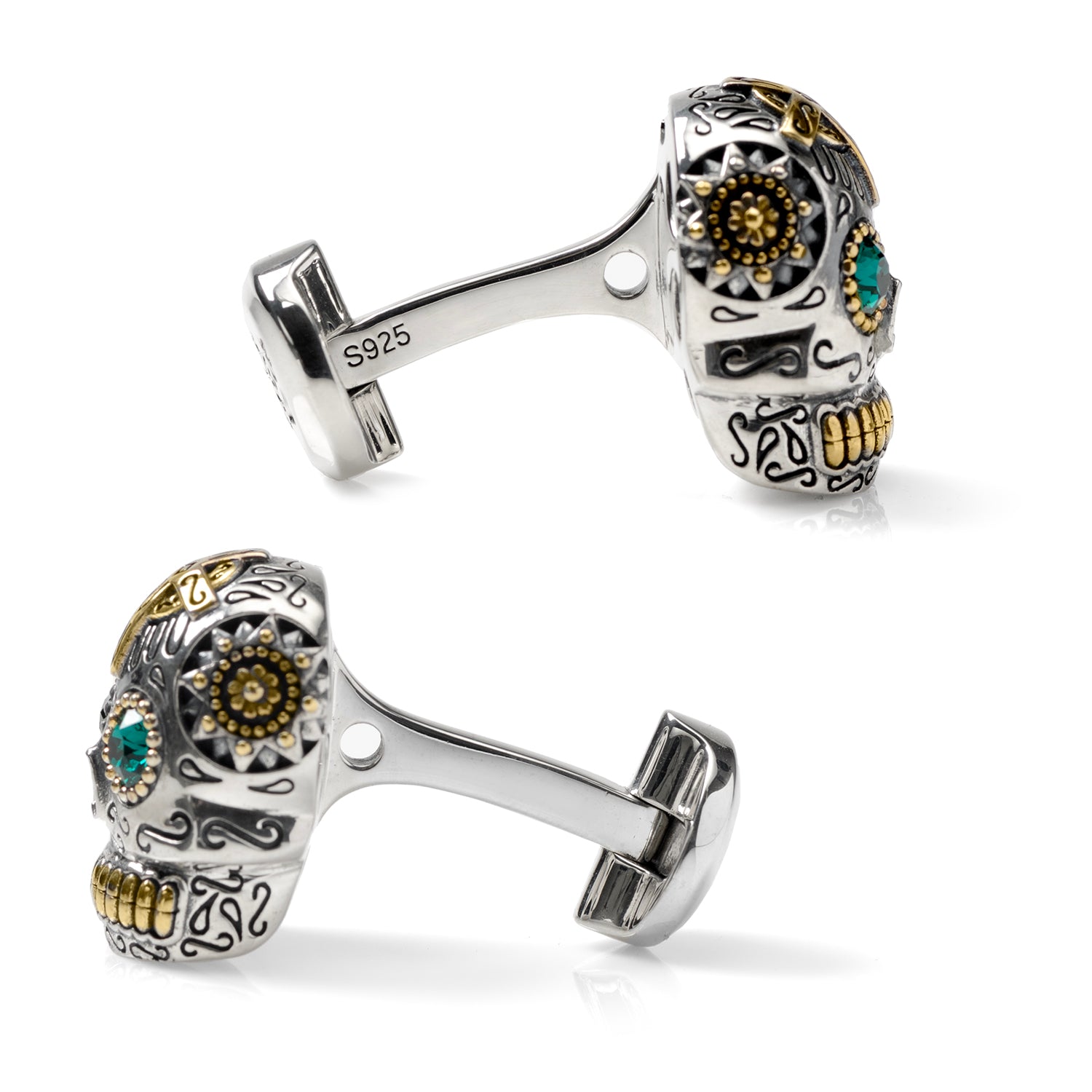 Cufflinks.com Sterling Silver and Gold Day of the Dead Skull Cufflinks feature metallic skulls with gold accents, green gem eyes, and intricate decorative patterns.