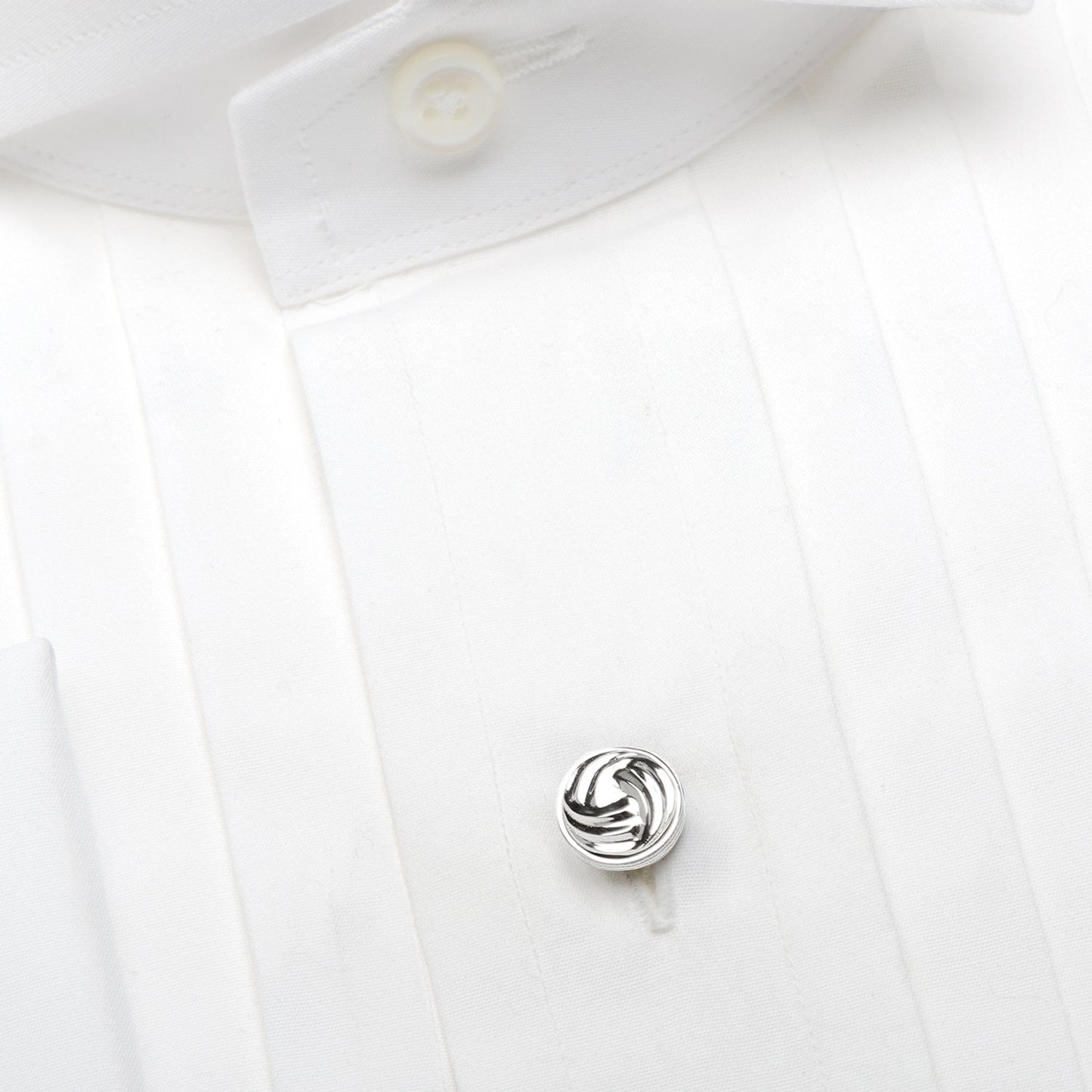 Five Modern Knot Sterling Silver 5-Studs by Cufflinks.com, each featuring a circular, swirled knot design, are arranged in an inverted V shape on a white background.