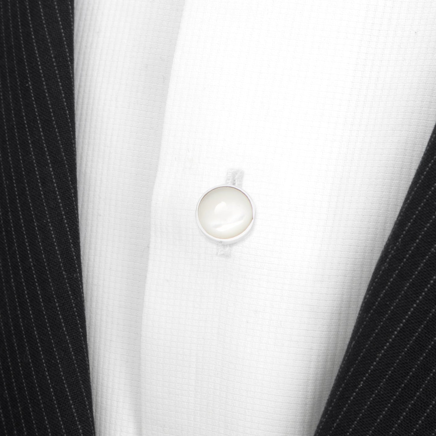 Five Sterling Silver Ribbed Mother of Pearl 5-Studs from Cufflinks.com are showcased upright in two rows against a white background, highlighting the timeless elegance of refined men's accessories.