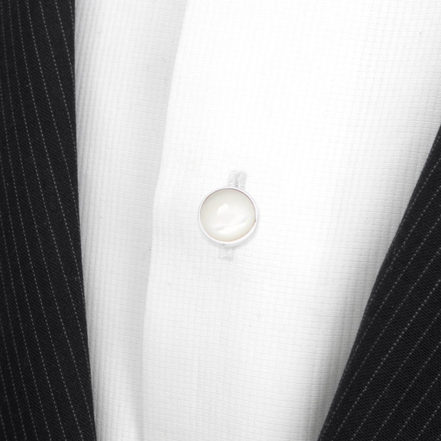 Five Sterling Silver Ribbed Mother of Pearl 5-Studs from Cufflinks.com are showcased upright in two rows against a white background, highlighting the timeless elegance of refined men's accessories.