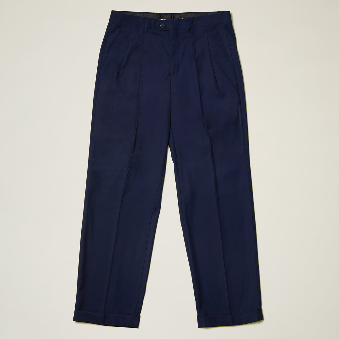 Inserch Regular Fit Two Pleat Pants P1199S-36 Ink: navy blue poly-rayon trousers with pleated front, side pockets, belt loops, and cuffed hems by Inserch, shown laid flat on a light background.
