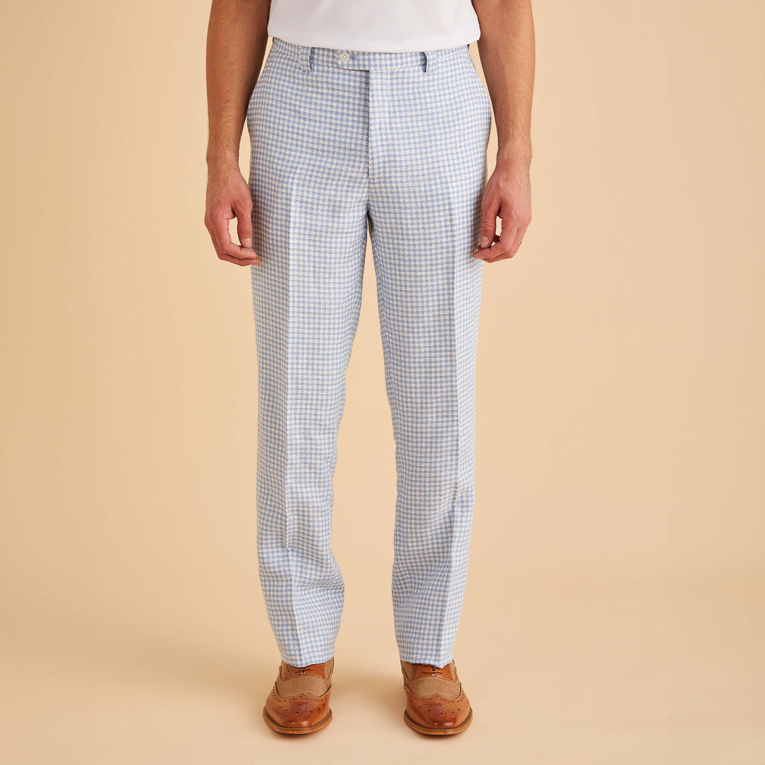 A man wearing the Inserch Linen Houndstooth Jacket JS269-00014 Lt. Blue by Inserch with matching pants stands against a plain beige background.