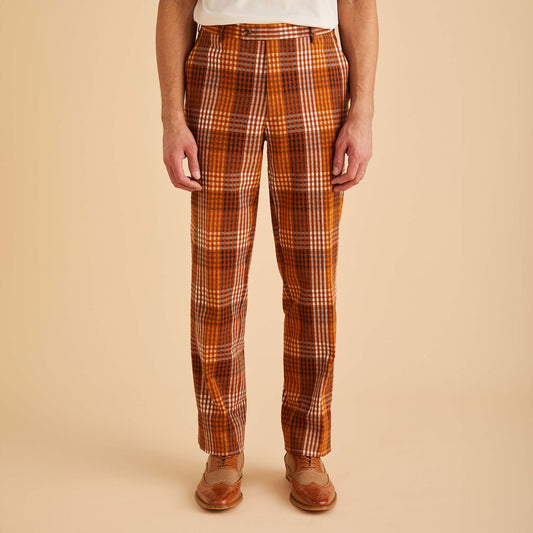 Someone in Inserch Seersucker Gingham Pants P272-00027 Aztec, featuring a modern fit and premium cotton, confidently stands against a beige background wearing brown shoes.
