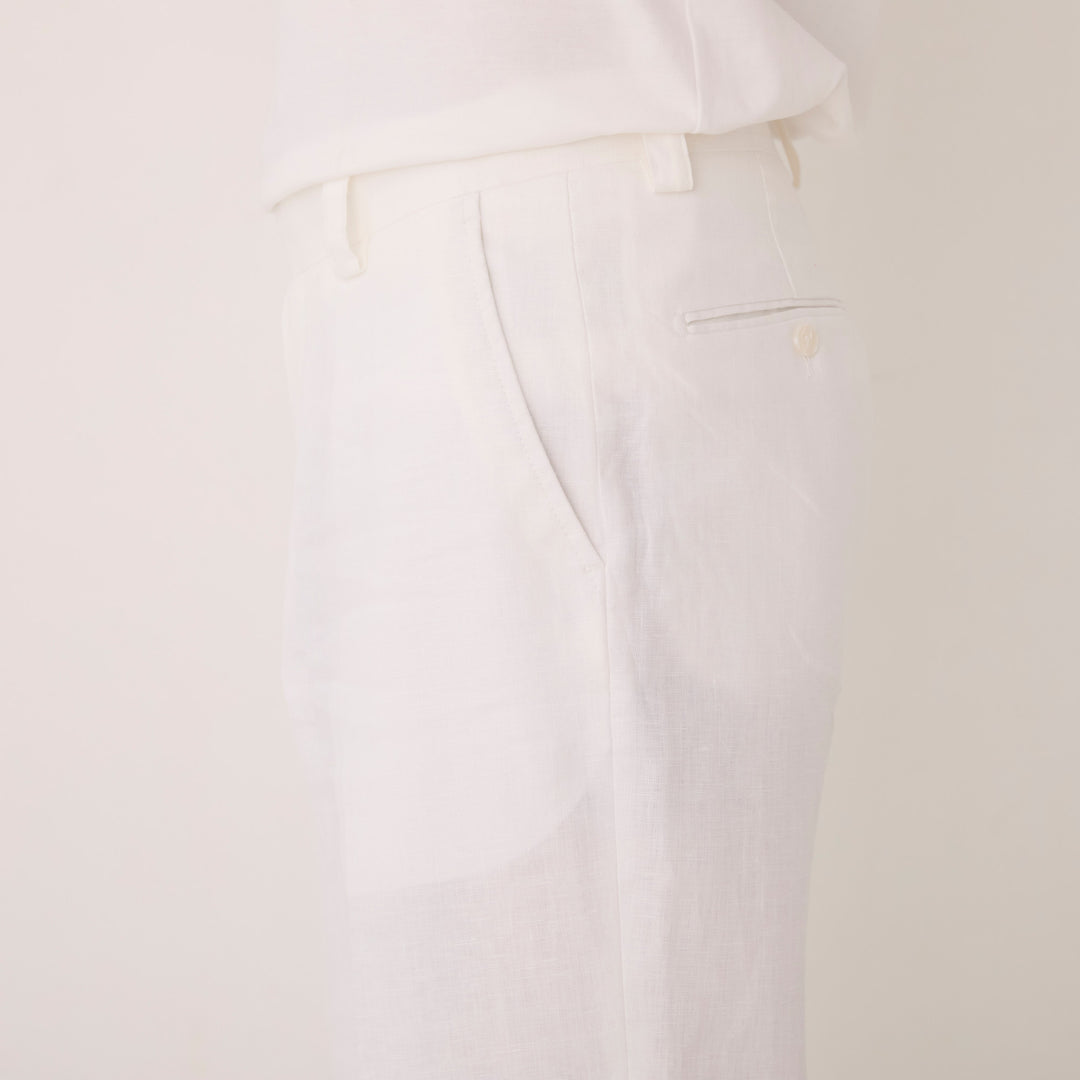 Inserch Linen Pants P3110-00002 in white, by Inserch, are shown laid flat on a light background. They feature a modern fit with button closure and side pockets.