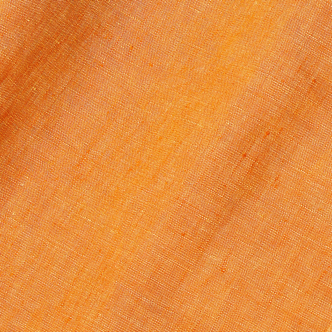 Close-up of Inserch Linen Pants P3116-00191 Sunburst fabric, featuring orange European flax with a fine, visible weave and subtle shadows that highlight the premium texture and folds.