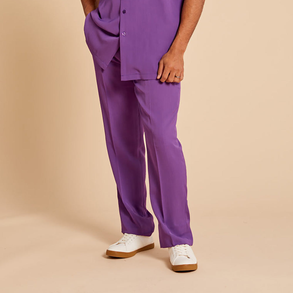 A person models Inserch Crepe Flat Front Pants P3156-00087 in plum, paired with a matching shirt and white sneakers, standing against a beige background.