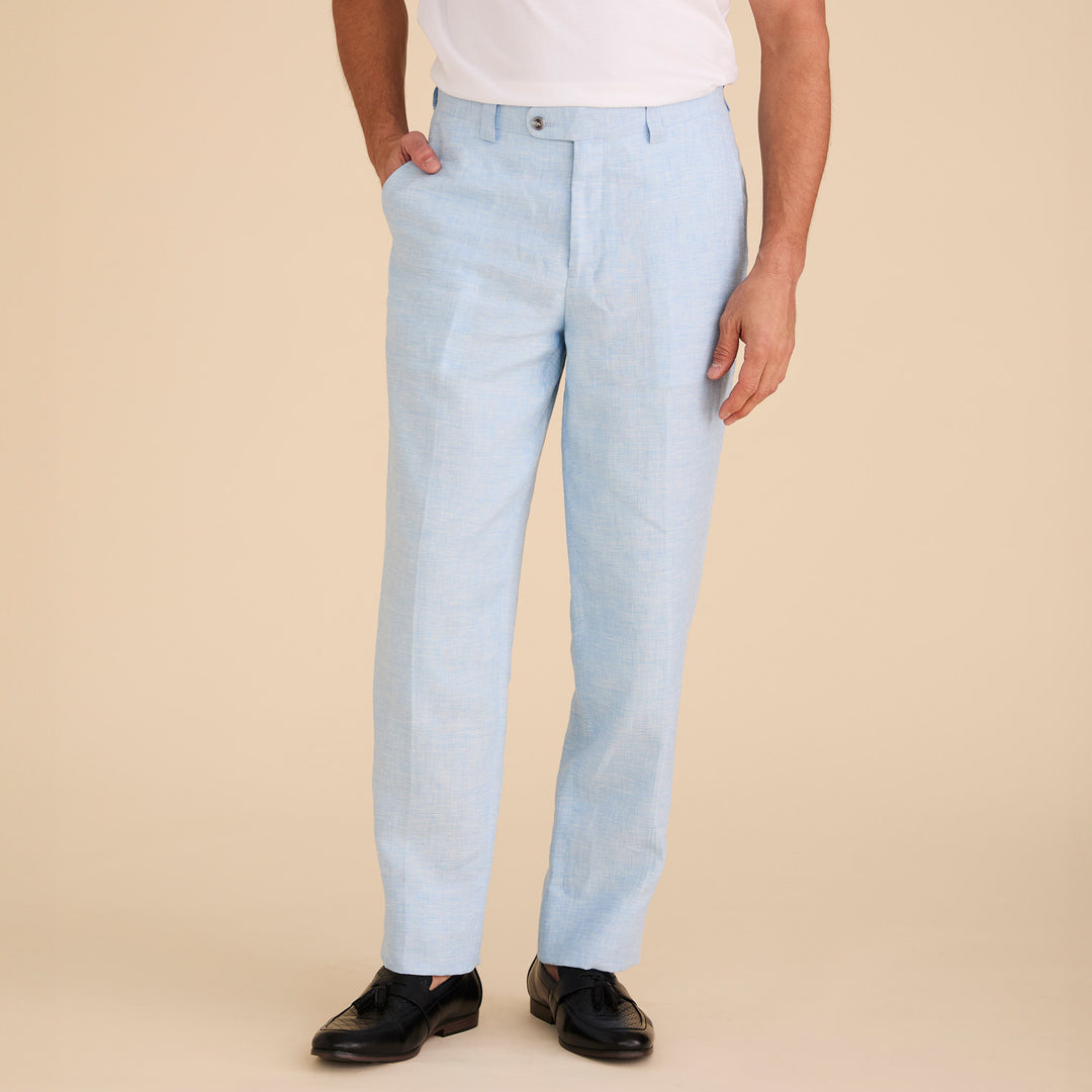 A man stands against a white background, wearing the Inserch Linen 2pc Set (SS717) in Blue Mist: a light blue short-sleeve shirt and matching pants by Inserch.