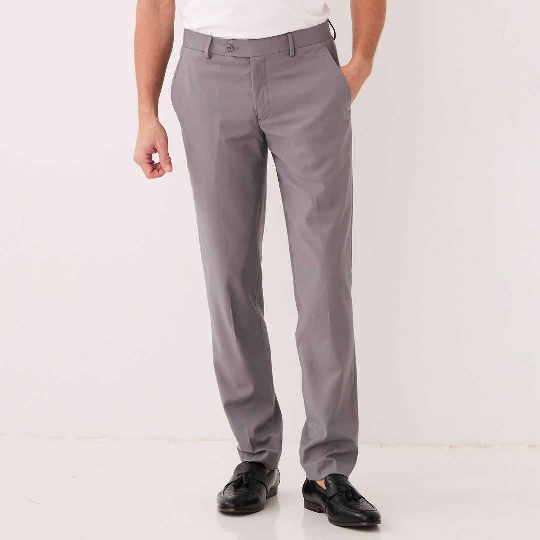 Someone wears Inserch Slim Fit Pants P3999S-33 Grey with a white shirt and black dress shoes, standing against a plain white background.