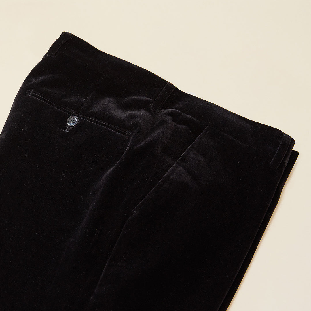 The Inserch Velvet Pants P502-01 Black by Inserch are modern-fit black velvet chinos with a visible back pocket and button, neatly folded and displayed on a light-colored surface.