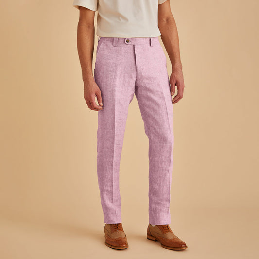 A person in a premium cream linen shirt, Inserch Slim Linen Pants P880-00193 Desert Rose by Inserch, and brown brogue shoes stands elegantly against a beige background.