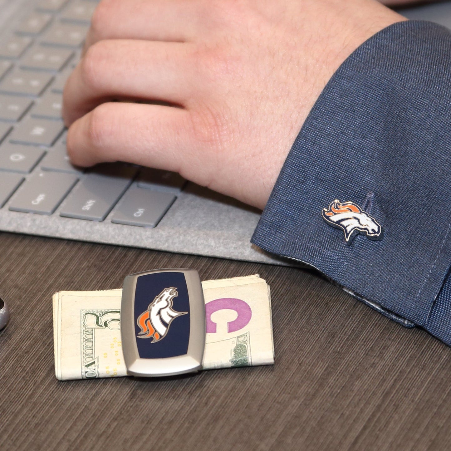 NFL Denver Broncos Cufflinks by Cufflinks.com feature the team's horse head logo in orange, white, and navy blue on a silver base.