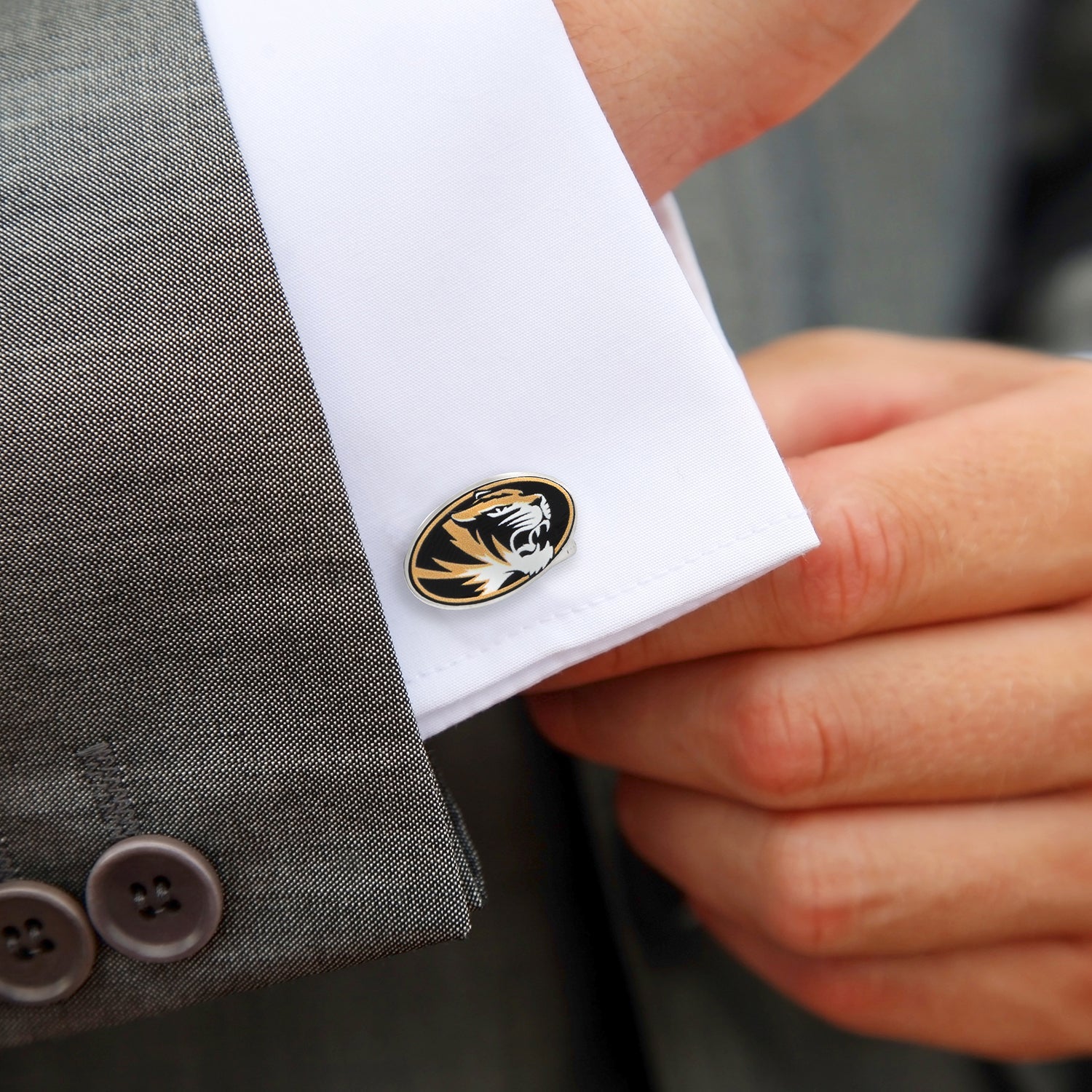 Display your school spirit with NCAA University of Missouri Tigers Cufflinks by Cufflinks.com, featuring the Tigers logo in black, gold, and white on a polished silver-tone base.