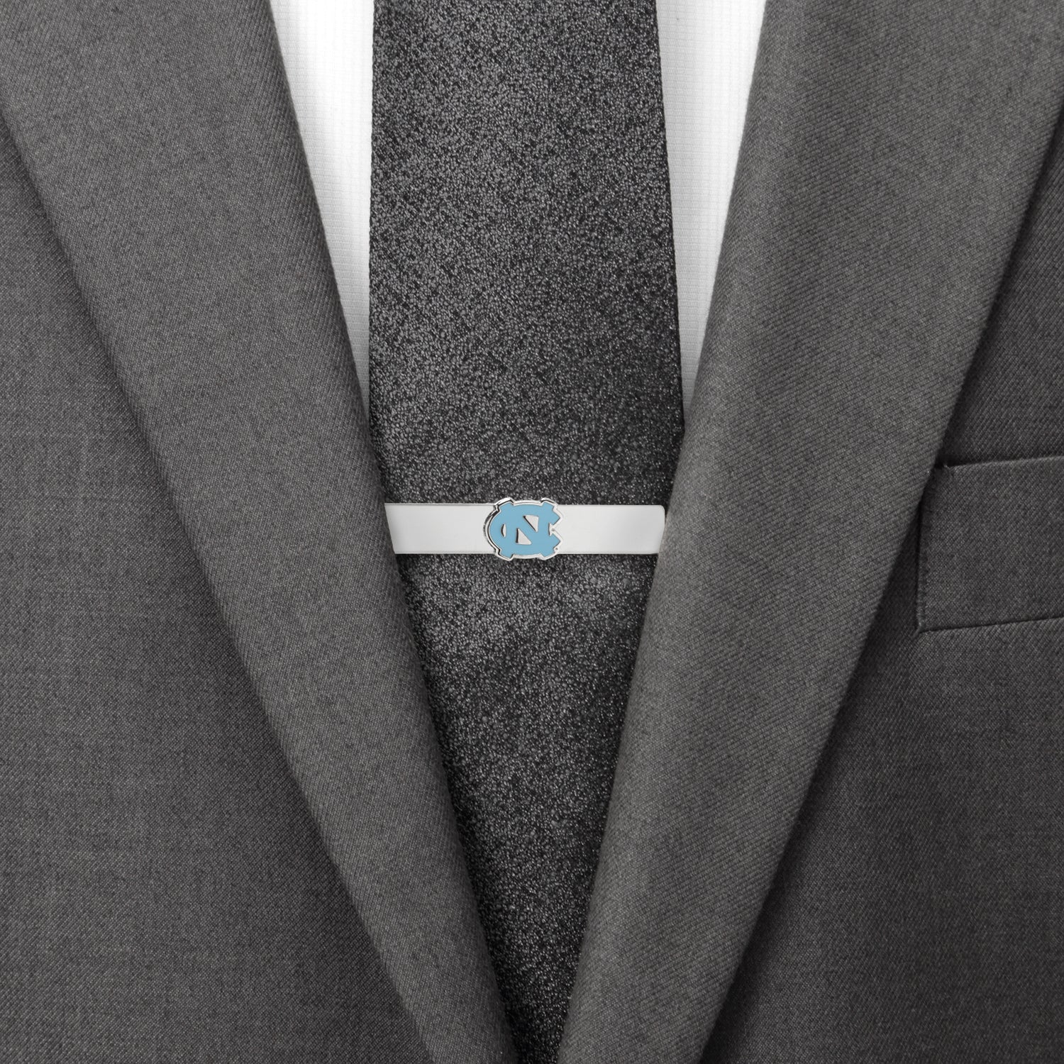 The NCAA University of North Carolina Tar Heels Tie Bar by Cufflinks.com features a silver finish with a blue logo, perfect for any Tar Heels fan or NCAA supporter.