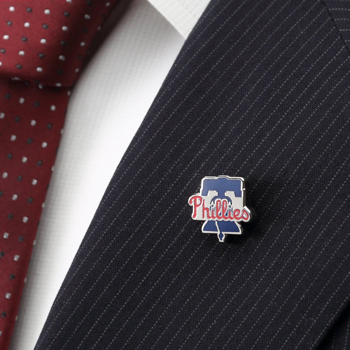 Show off your team pride with the MLB Philadelphia Phillies Lapel Pin from Cufflinks.com, featuring the iconic team's red script logo over a blue Liberty Bell—perfect for any fan’s collection.