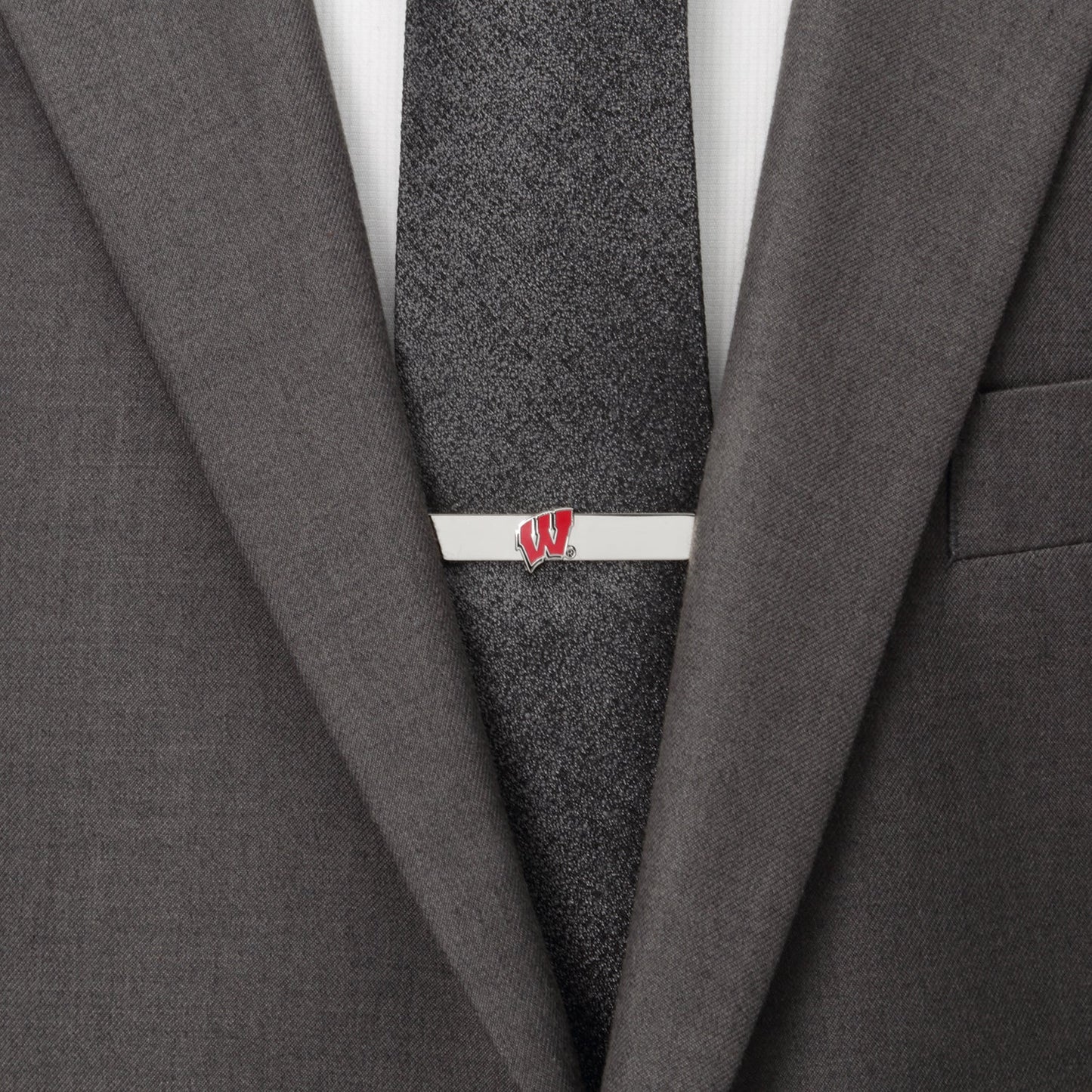 The NCAA University of Wisconsin Badgers Cufflinks and Tie Bar Set by Cufflinks.com features silver pieces with a red "W" logo on white—an ideal gift for any Wisconsin fan.