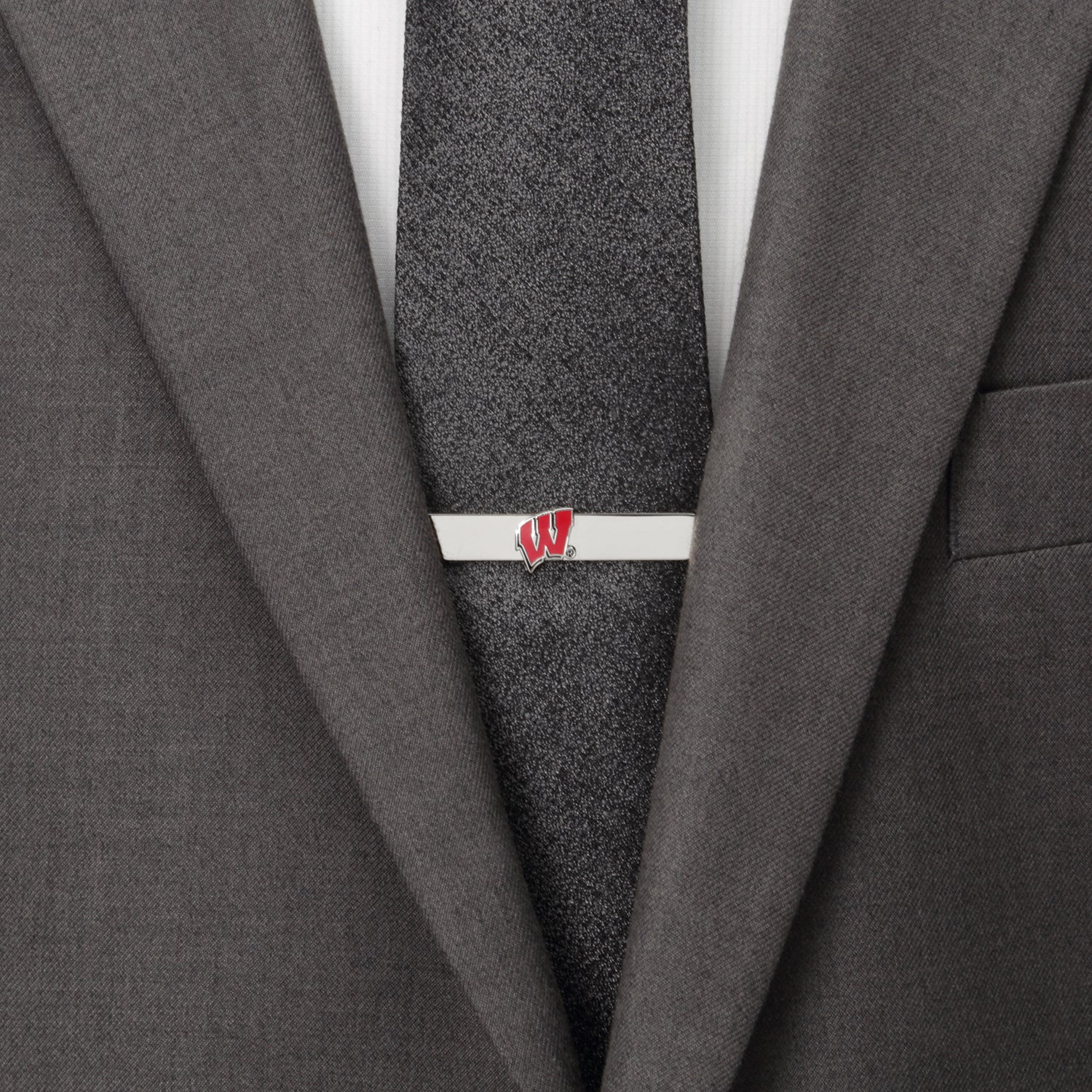 The NCAA University of Wisconsin Badgers Cufflinks and Tie Bar Set by Cufflinks.com features silver pieces with a red "W" logo on white—an ideal gift for any Wisconsin fan.