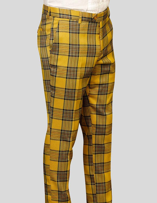 STATEMENT CLOTHING | PLAID SLIM FIT PANTS PL-301-GOLD by Statement Clothing, featuring a yellow plaid design with black and green stripes made from soft wool, elegantly worn by a person.