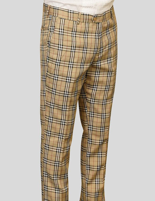 A person wearing Statement Clothing's Plaid Slim Fit Pants in tan.